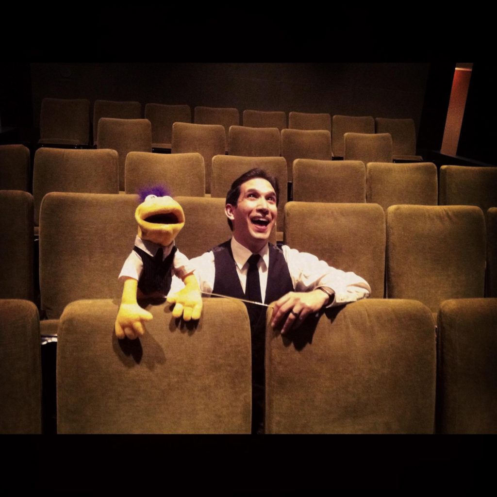 Freddie the Puppet and Scott Gryder in a theater