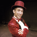 Scott Gryder wearing a red sequin suit with top hat