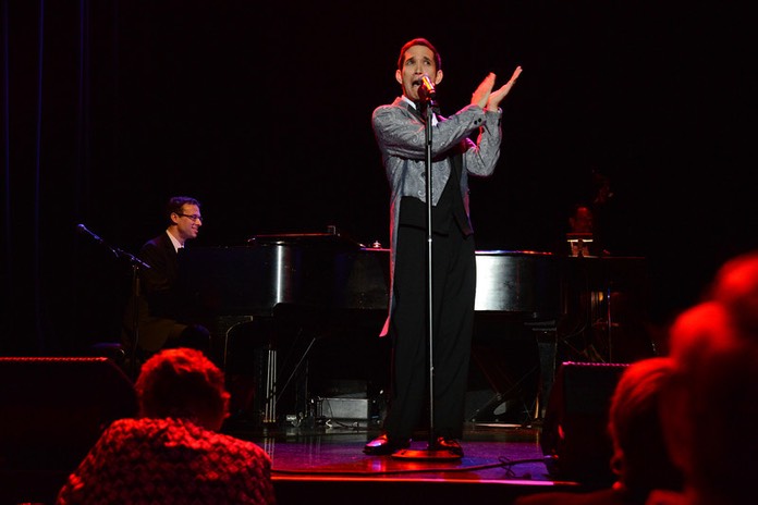 Scotty clapping at mic stand, Nick Sula at piano in background