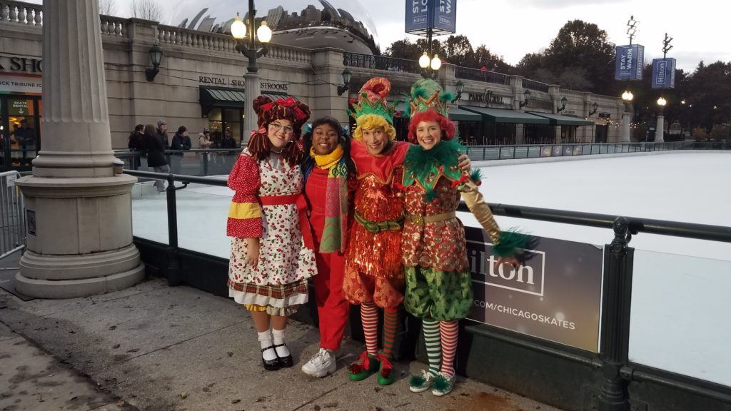 Four elves near the ice Skating Rink